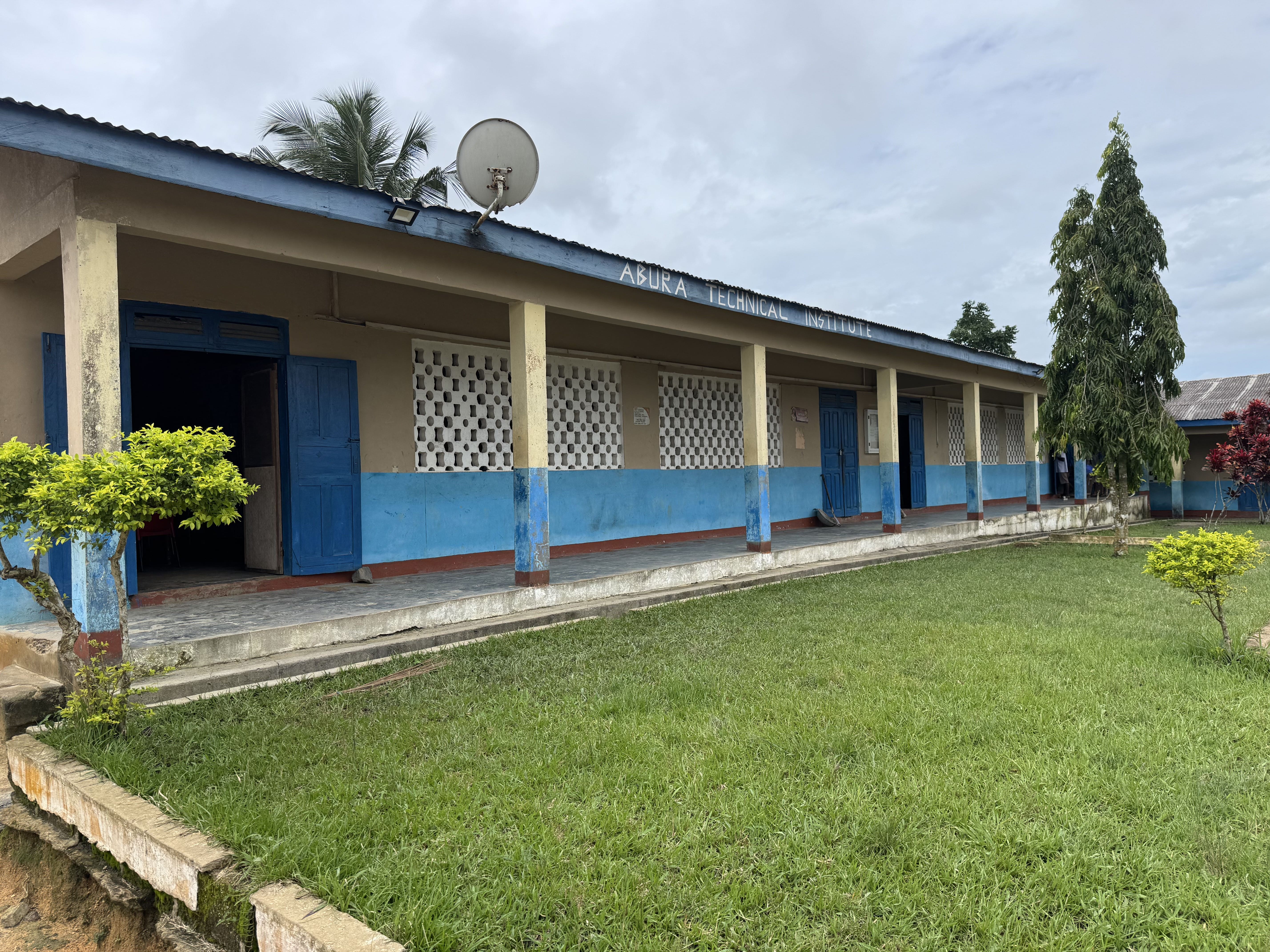 A classroom block bearing the Abura Technical Institute name